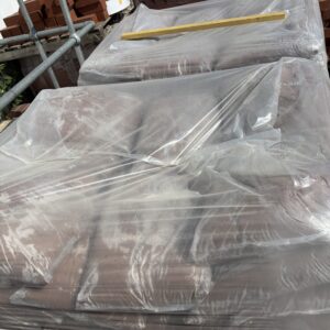 Bags of sand wrapped in plastic.