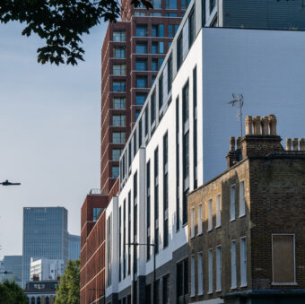 Grey linear bricks, white glazed bricks and white painted bricks used on commercial development in central london.