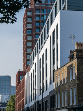 Grey linear bricks, white glazed bricks and white painted bricks used on commercial development in central london.