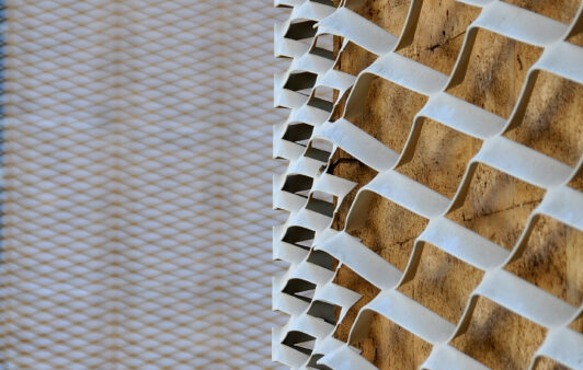 Close up of white expanded mesh cladding