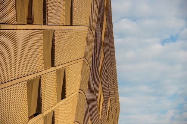 Gold expanded mesh cladding at dubai arena