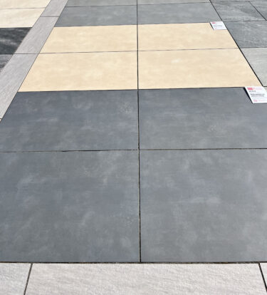 Varying colours of porcelain paving laid neatly.