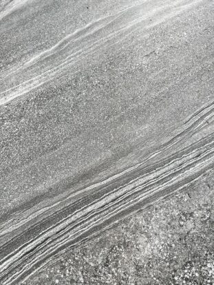 A close up of a marble-effect porcelain paving slab.