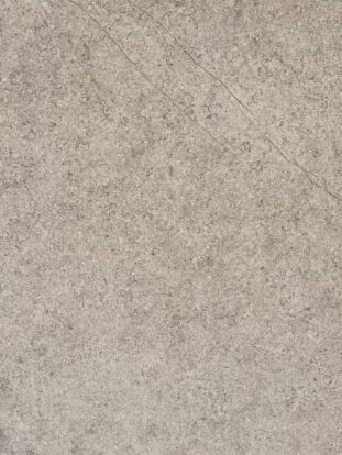 A close up of a beige-coloured porcelain paving slab.
