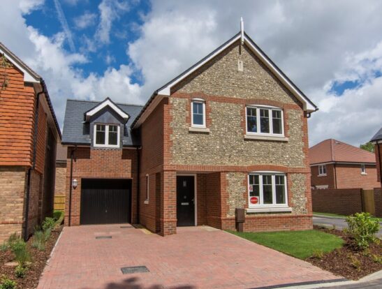 A house clad in flint blocks on a housing estate.