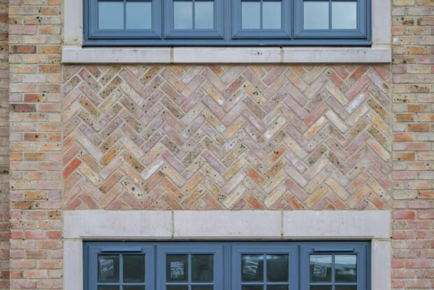 Red and yellow herringbone brickwork on Hayfield Crescent luxury housing