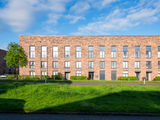 Three-storey town houses surrounded by green space, completed using Heritage Dragwire and Village harvest Multi facing bricks.