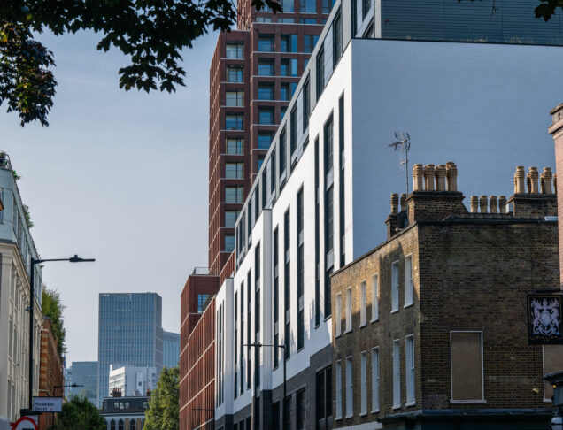 Grey linear bricks, white glazed bricks and white painted bricks used on commercial development in central london.