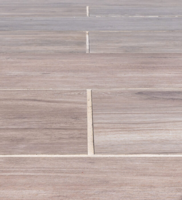 Ain image of neatly laid porcelain slabs in a wood-effect finish.
