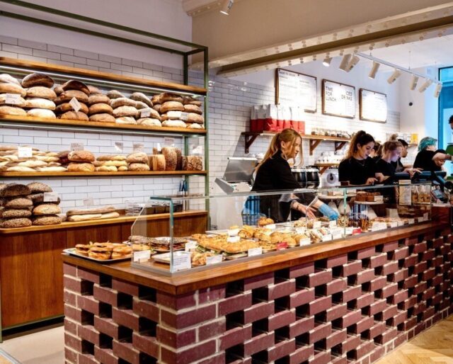 A bakery with a counter built from pink bricks in a hit-and-miss pattern.