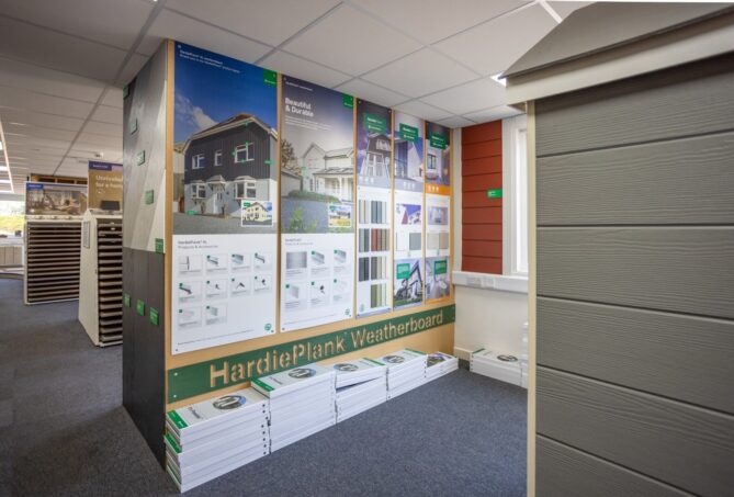 A view through a building supply showroom with a James Hardie display in the foreground.