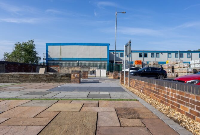 An outdoor paving display featuring natural stone and porcelain pavers.