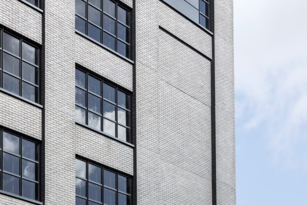 Side angles of the black brickwork around the windows on the Dakota Hotel, Manchester